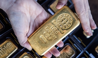 Giá vàng tăng vọt, đồng USD tụt giá sau cuộc họp Fed