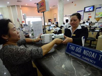 “Cân đong” bài toán tỷ giá và lãi suất