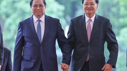 Vietnamese, Lao leaders vow to enhance economic-trade ties