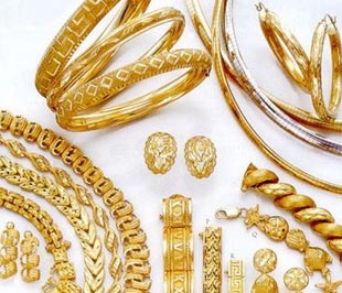 Giá vàng giảm nhẹ, USD giữ giá