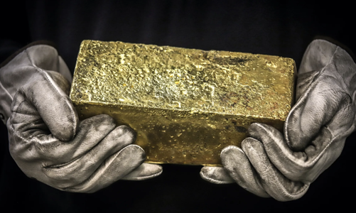 Giá vàng tăng vụt trở lại ngưỡng 2.700 USD/oz sau khi Fed hạ lãi suất