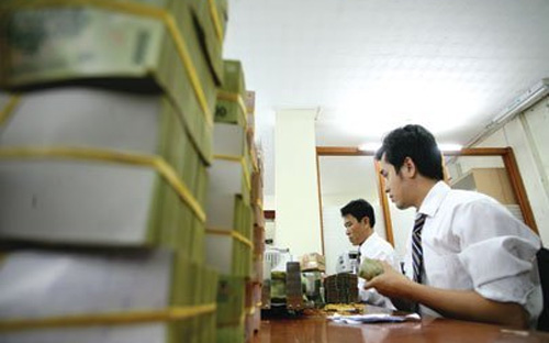 Các nhà đầu tư sẽ được quyền tham gia vào quá trình xử lý nợ và tài sản của VAMC theo nguyên tắc thị trường dưới hình thức bán đấu giá - Ảnh: TBKTSG.