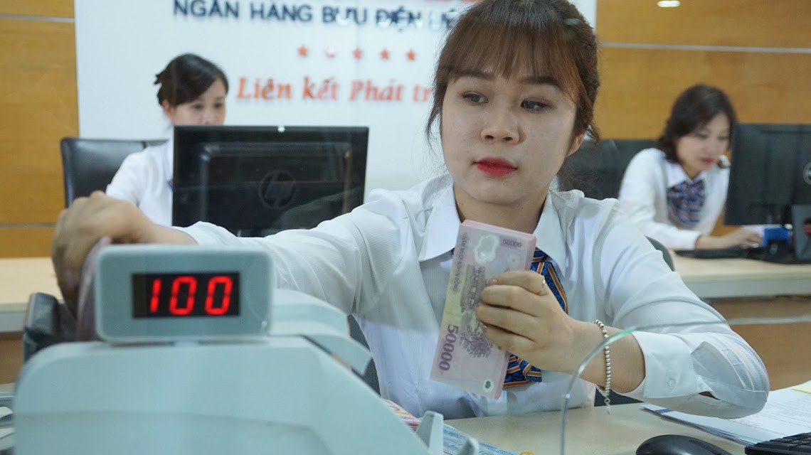 Đến cuối tháng 6/2018 tỷ lệ nợ xấu so với so với tổng nợ là 2,09%, giảm so với thời điểm 31/12/2016 (2,46%) - Ảnh: Quang Phúc.