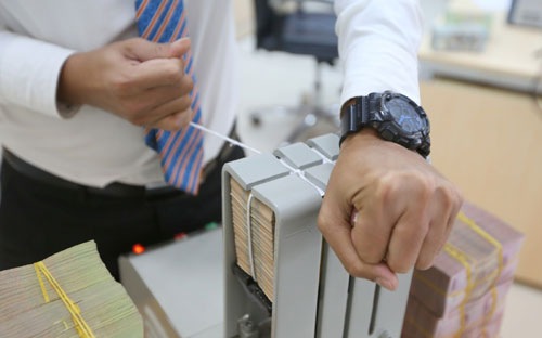 Ngân hàng Nhà nước vẫn giữ tinh thần chung là siết lại các điều kiện an toàn, nhưng giãn mức độ và lộ trình thực hiện để thị trường từng bước thích nghi - Ảnh: Quang Phúc.<br>