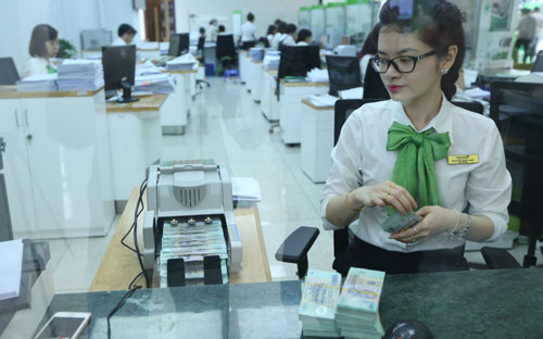 Theo Ngân hàng Nhà nước, tốc độ tăng trưởng tín dụng nửa đầu năm nay là phù hợp với chỉ tiêu định hướng 18-20% của cả năm - Ảnh: Quang Phúc.<br>
