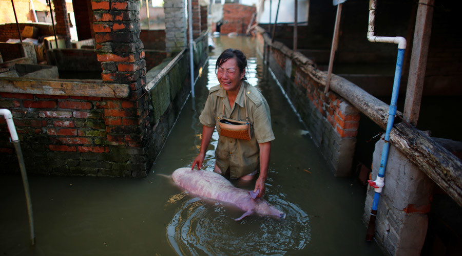 Nhiều nông hộ của Trung Quốc đã chịu thiệt hại lớn trong đợt lũ lụt tháng 7/2016 - Ảnh: Reuters.<br>