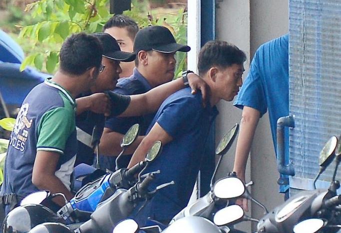 Nghi phạm Ri Jong Chon bị cảnh sát Malaysia bắt giữ hôm 18/2 - Ảnh: Reuters.<br>