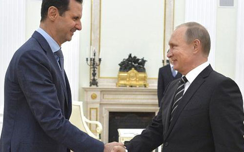 Tổng thống Syria Bashar al-Assad (trái) và Thủ thống Nga Vladimir Putin tại điện Kremlin ngày 20/10 - Ảnh: Reuters.<br>