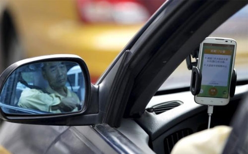 Didi, công ty có tên gọi chính thức là Xiaoju Kuaizhi Inc., được thành 
lập vào năm ngoái khi một số ứng dụng riêng rẻ do Tencent và Alibaba hậu
 thuẫn sáp nhập làm một - Ảnh: Reuters. 