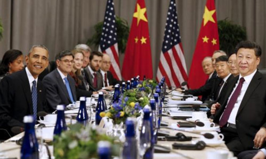Tổng thống Mỹ Barack Obama (trái) và Chủ tịch Trung Quốc Tập Cận Bình (phải) trong cuộc gặp tại hội nghị thượng đỉnh an ninh hạt nhân ở Washington, Mỹ ngày 31/3 - Ảnh: Reuters.<br>