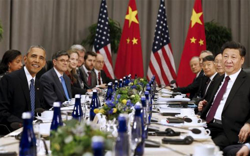 Tổng thống Mỹ Barack Obama (trái) và Chủ tịch Trung Quốc Tập Cận Bình (phải) trong cuộc gặp tại hội nghị thượng đỉnh an ninh hạt nhân ở Washington, Mỹ ngày 31/3 - Ảnh: Reuters.<br>