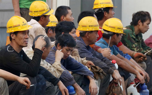 Sự giảm tốc của kinh tế Trung Quốc đang gây ảnh hưởng tới toàn thế giới - Ảnh: Bloomberg.<br>