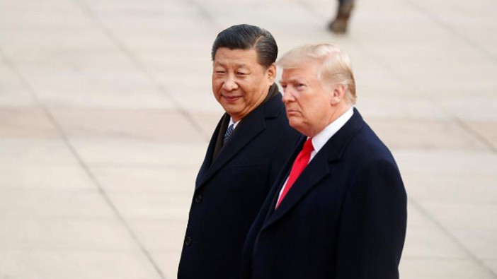 Chủ tịch Trung Quốc Tập Cận Bình (trái) và Tổng thống Mỹ Donald Trump trong lễ đón chính thức ông Trump thăm cấp nhà nước tới Trung Quốc tại Bắc Kinh, sáng 9/11 - Ảnh: Reuters.