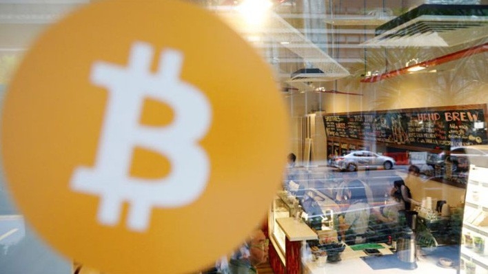Bên trong một quán cafe nhận thanh toán bằng Bitcoin ở Singapore - Ảnh: Reuters.