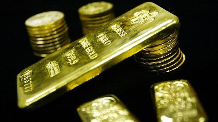 Tín hiệu từ FED và sự sụt giá của đồng USD giúp củng cố lực tăng cho giá vàng - Ảnh: Getty/CNBC.