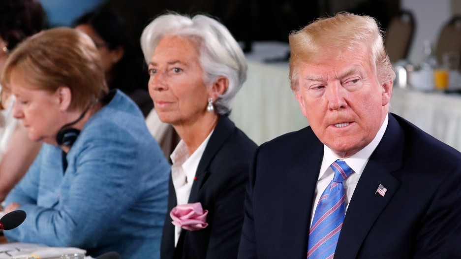 Từ phải qua: Tổng thống Mỹ Donald Trump, Tổng giám đốc Quỹ Tiền tệ Quốc tế (IMF) Christine Lagarde, và Thủ tướng Đức Angela Markel tại thượng đỉnh khối G7 ở Quebec, Canada, tháng 6/2018 - Ảnh: Reuters.