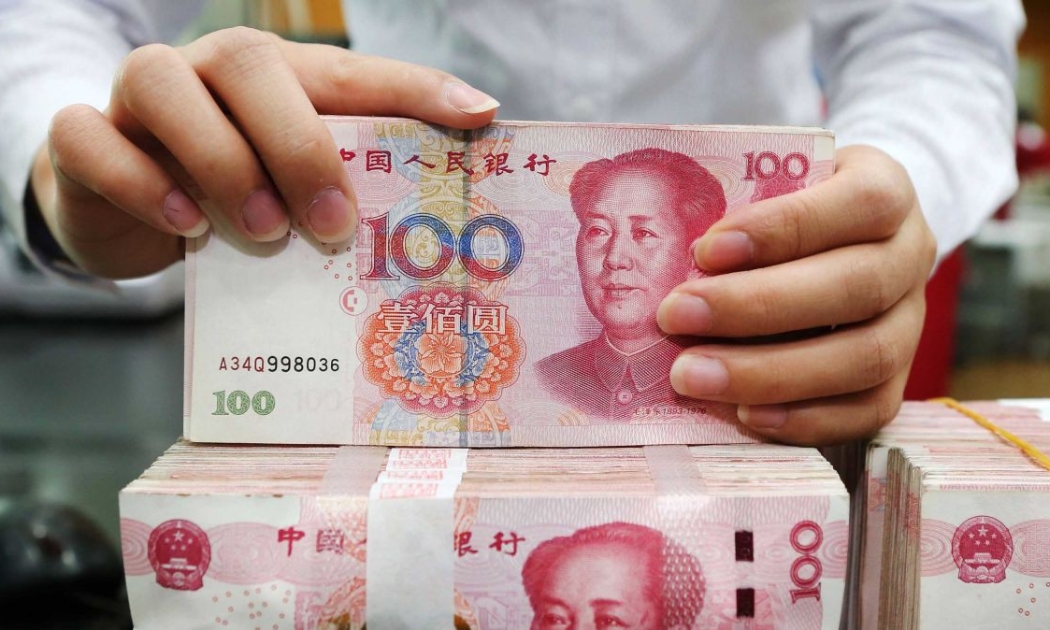 Ngày 5/8, tỷ giá Nhân dân tệ so với đồng USD sụt dưới ngưỡng quan trọng 7 tệ đổi 1 USD, thấp nhất 1 thập kỷ - Ảnh: CNN.