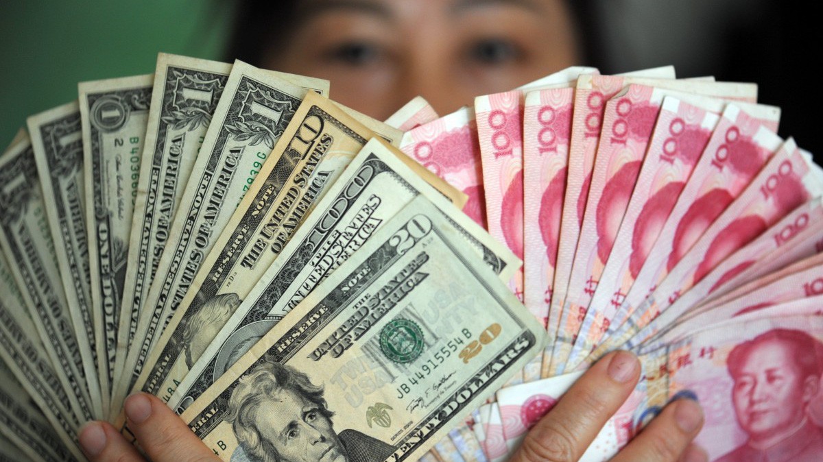 Từ tháng 8 tới nay, Nhân dân tệ đã giảm giá 2,78% so với USD - Ảnh: Xinhua/SCMP.