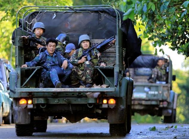 Lực lượng Chính phủ Philippines ở Marawi ngày 26/5 - Ảnh: Reuters.<br>