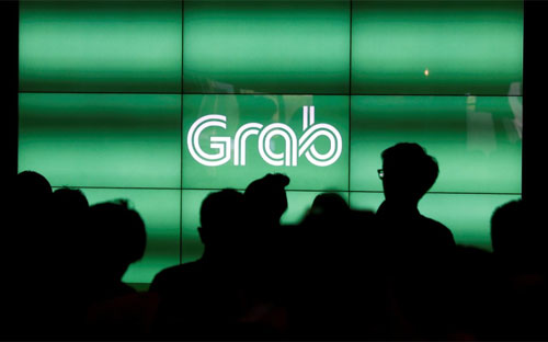 Grab hiện có dịch vụ bao gồm cả xe hơi và xe máy tại 7 quốc gia, với 1,2 triệu tài xế - Ảnh: Reuters.<br>