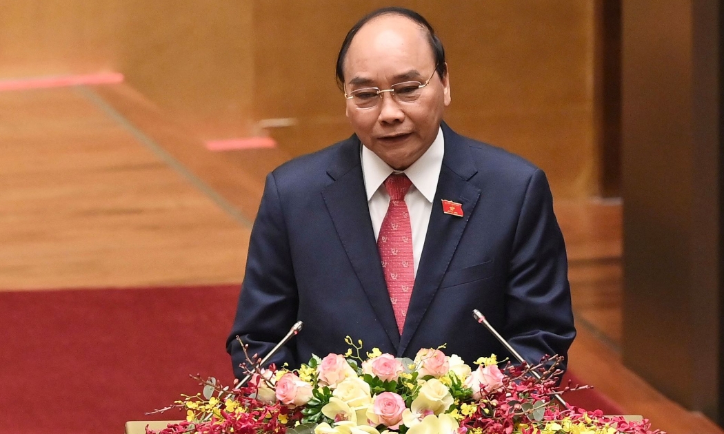 Thủ tướng Chính phủ Nguyễn Xuân Phúc trình bày báo cáo công tác nhiệm kỳ Chính phủ tại Kỳ họp 11 Quốc hội khóa 14 - Ảnh: VGP