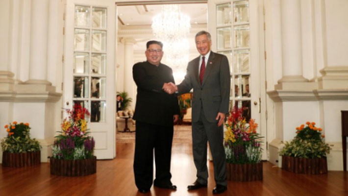 Những hình ảnh đầu tiên của ông Trump và ông Kim Jong Un ở Singapore - Ảnh 5.
