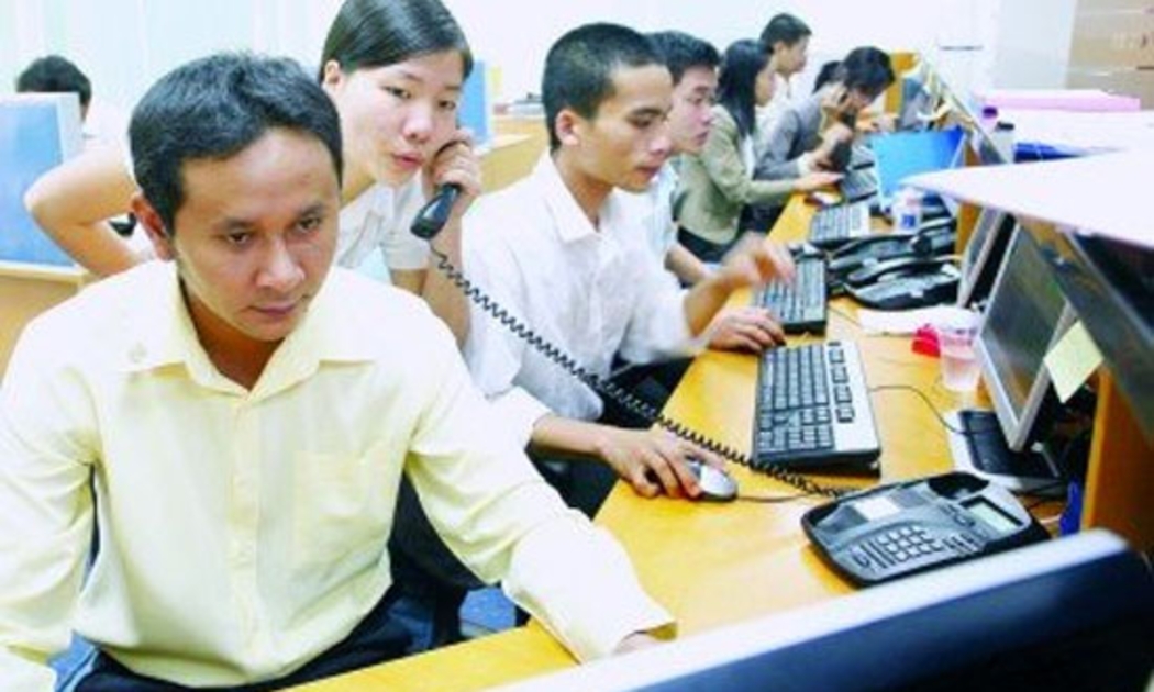 Nhân viên nhập lệnh của một sàn vàng ở Tp.HCM lúc còn hưng thịnh - Ảnh: Lê Toàn.