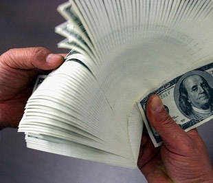 Trong 3 tháng qua, giá USD đã tăng 2,05% so với VND - Ảnh: Getty.