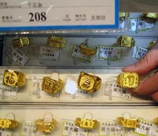 Doanh số thị trường vàng Trung Quốc đại lục, Hồng Kông và Đài Loan năm nay có lẽ sẽ không tăng so với năm ngoái do tác động của khủng hoảng tài chính - Ảnh: People Daily.