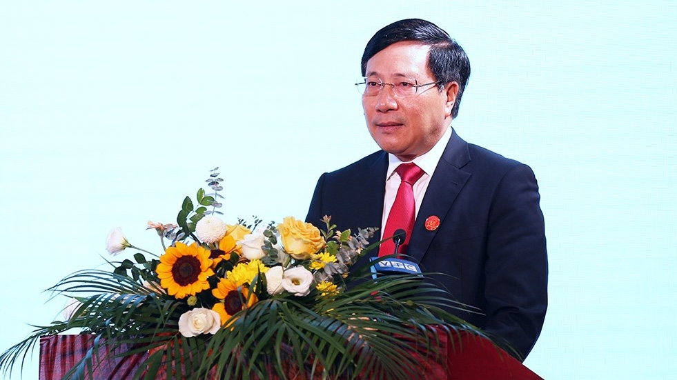 Phó thủ tướng Phạm Bình Minh trình bày báo cáo tại hội nghị - Ảnh: QH 