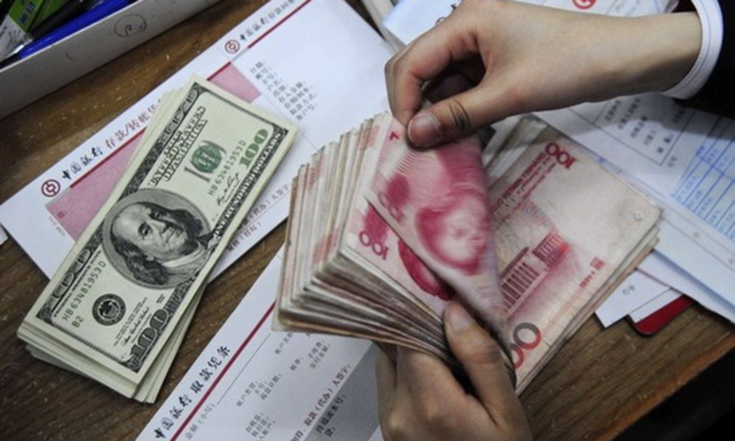 Nhân dân tệ vẫn là vấn đề nóng trong đối thoại Mỹ-Trung - Ảnh: Reuters.