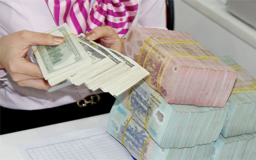 Đây là lần đầu tiên Ngân hàng Nhà nước điều chỉnh tỷ giá kể từ cuối năm 2011. 