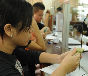 Theo quy định của Bộ Tài chính, chỉ chấp nhận một hình thức thanh toán áp dụng cho các doanh nghiệp thanh toán qua tài khoản - Ảnh: Quang Liên.