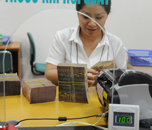 Từ sự khó khăn của thị trường tiền tệ trong năm 2008, các ngân hàng đã khá thận trọng khi đưa ra chỉ tiêu lợi nhuận năm 2009 và kết quả là con số này được đánh giá là không quá cao - Ảnh: Quang Liên.