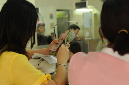 Sau Tết Nguyên đán, nguồn tiền gửi đã dần trở lại ngân hàng - Ảnh: Quang Liên.