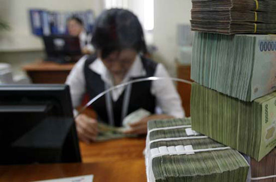 Lợi nhuận ngân hàng đang phân hóa rõ khi có trường hợp đầu tiên báo lỗ trong quý 4/2011 - Ảnh: Reuters.