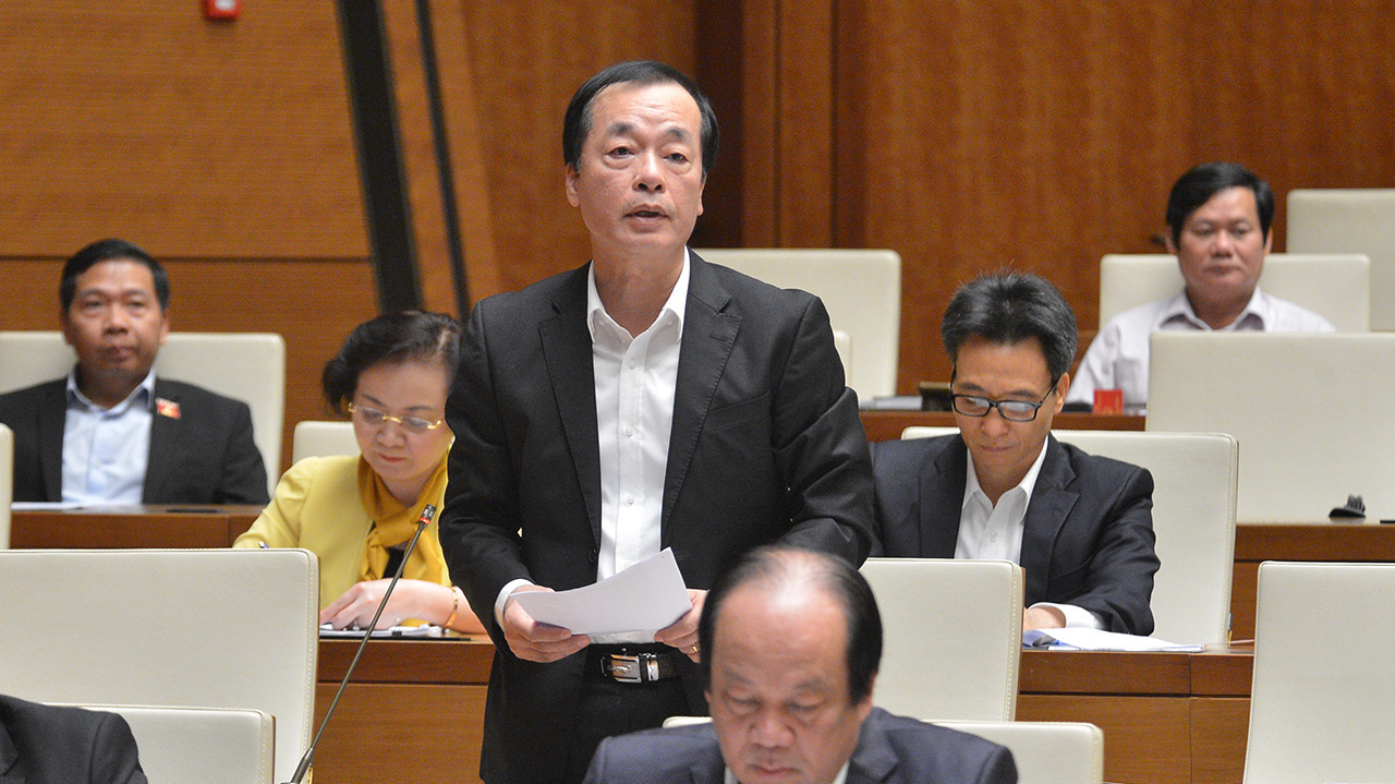 Bộ trưởng Bộ Xây dựng Phạm Hồng Hà trả lời chất vấn của các đại biểu Quốc hội - Ảnh: Quochoi.vn