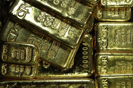 Áp lực giảm giá mạnh đối với giá vàng quốc tế đêm qua bắt nguồn từ đồng USD mạnh - Ảnh: Reuters.