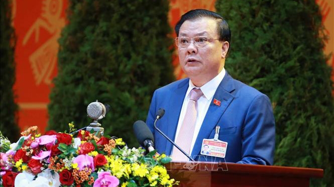 Đồng chí Đinh Tiến Dũng, Ủy viên Trung ương Đảng, Bộ trưởng Bộ Tài chính trình bày tham luận tại Đại hội.