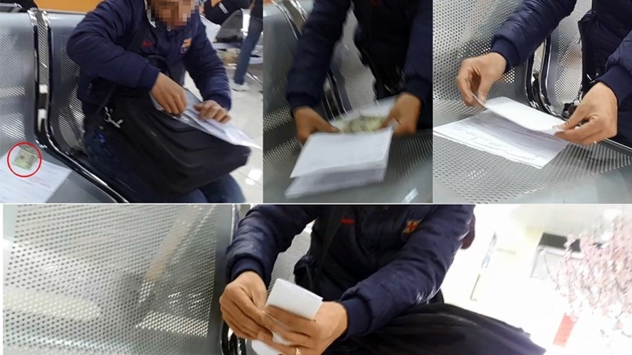Cảnh người dân, doanh nghiệp công khai kẹp tiền vào hồ sơ khi đến làm thủ tục tại Chi cục Hải quan cửa khẩu Đình Vũ, Hải Phòng - Ảnh: Lao Động.