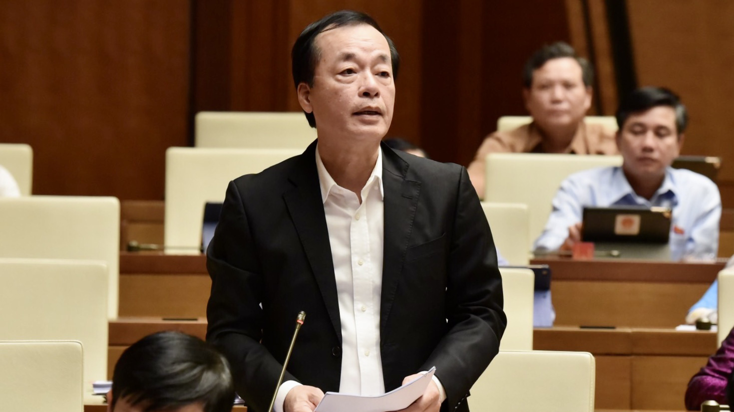 Bộ trưởng Bộ Xây dựng Phạm Hồng Hà trả lời chất vấn của đại biểu - Ảnh: VGP