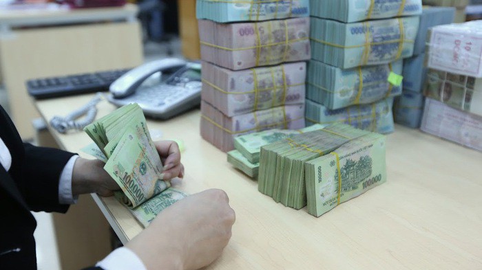 Một số chuyên gia kinh tế đề nghị thực hiện chính sách tiền tệ theo hướng thận trọng hơn - Ảnh: Quang Phúc 