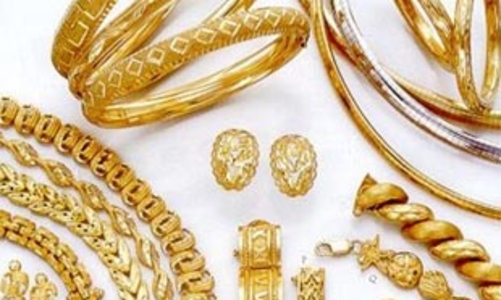 Giá vàng giảm nhẹ, USD giữ giá