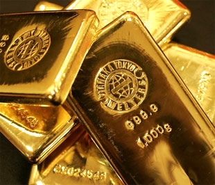 Giá vàng quốc tế chiều nay đã phục hồi mạnh hơn nhờ đồng USD suy yếu trở lại - Ảnh: Bloomberg.