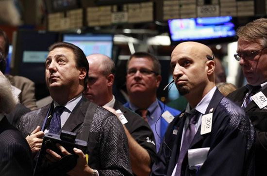 Phố Wall tăng giảm trái chiều trong phiên 15/4 - Ảnh: Reuters.