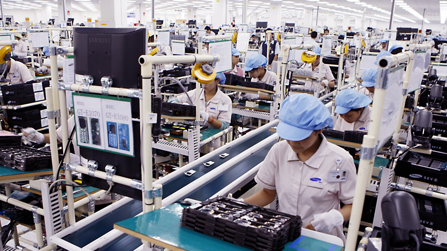 Doanh nghiệp phải đáp ứng 3 tiêu chí mới để được xác định là doanh nghiệp công nghệ cao - Ảnh: TTXVN