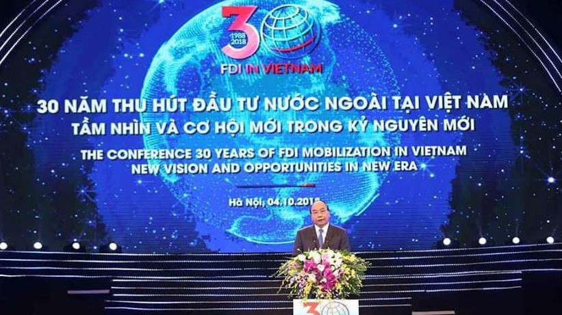 Thủ tướng Chính phủ Nguyễn Xuân Phúc phát biểu tại Hội nghị 30 năm thu hút đầu tư nước ngoài tại Việt Nam diễn ra sáng 4/10.