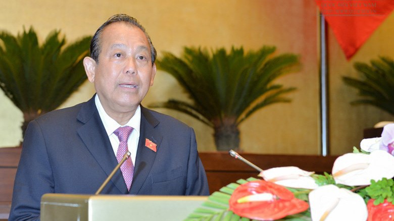 Phó thủ tướng Trương Hoà Bình trình bày báo cáo của Chính phủ.