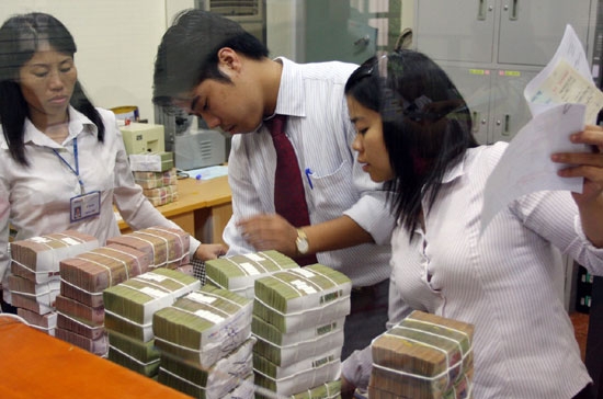 Chính phủ yêu cầu đảm bảo tính thanh khoản cho hệ thống ngân hàng dịp Tết - Ảnh: Việt Tuấn.