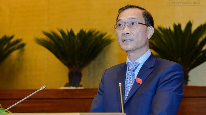 Chủ nhiệm Uỷ ban Kinh tế Vũ Hồng Thanh trình bày báo cáo giải trình, tiếp thu dự án luật.